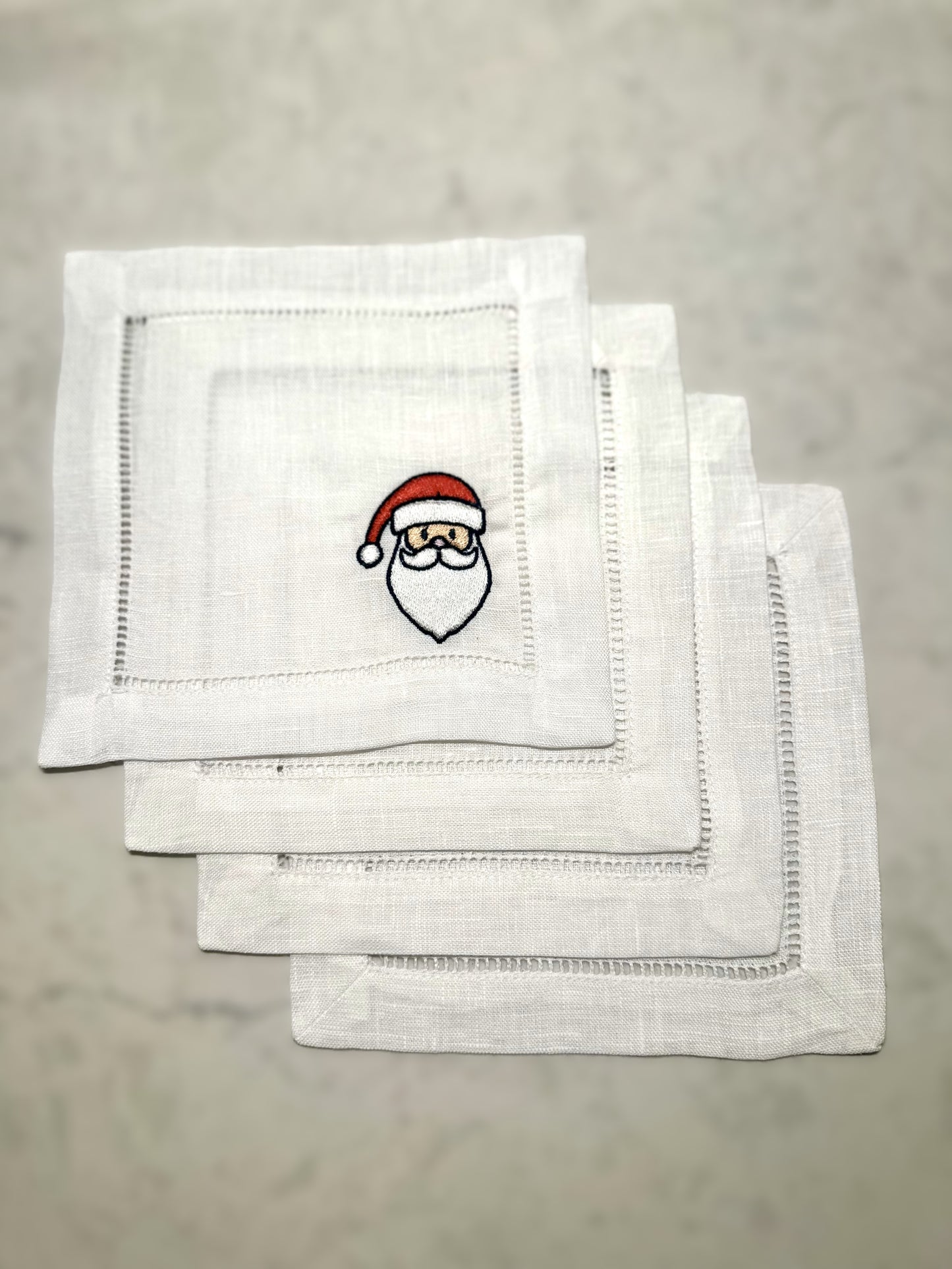 embroidered cocktail napkin with Santa face
