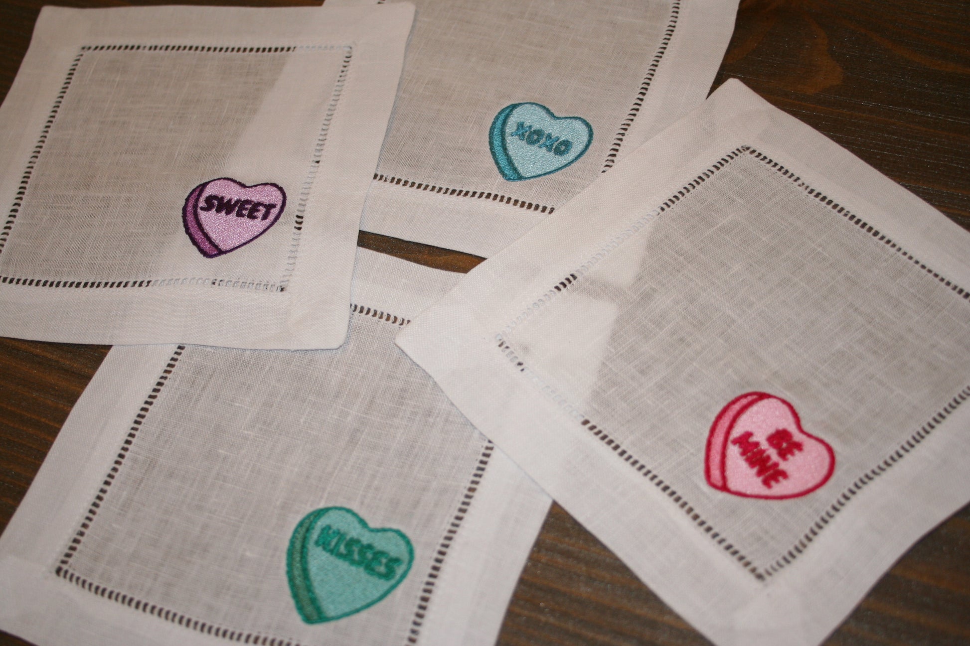 Embroidered cocktail napkins with 4 unique Valentine's Day Conversation Hearts