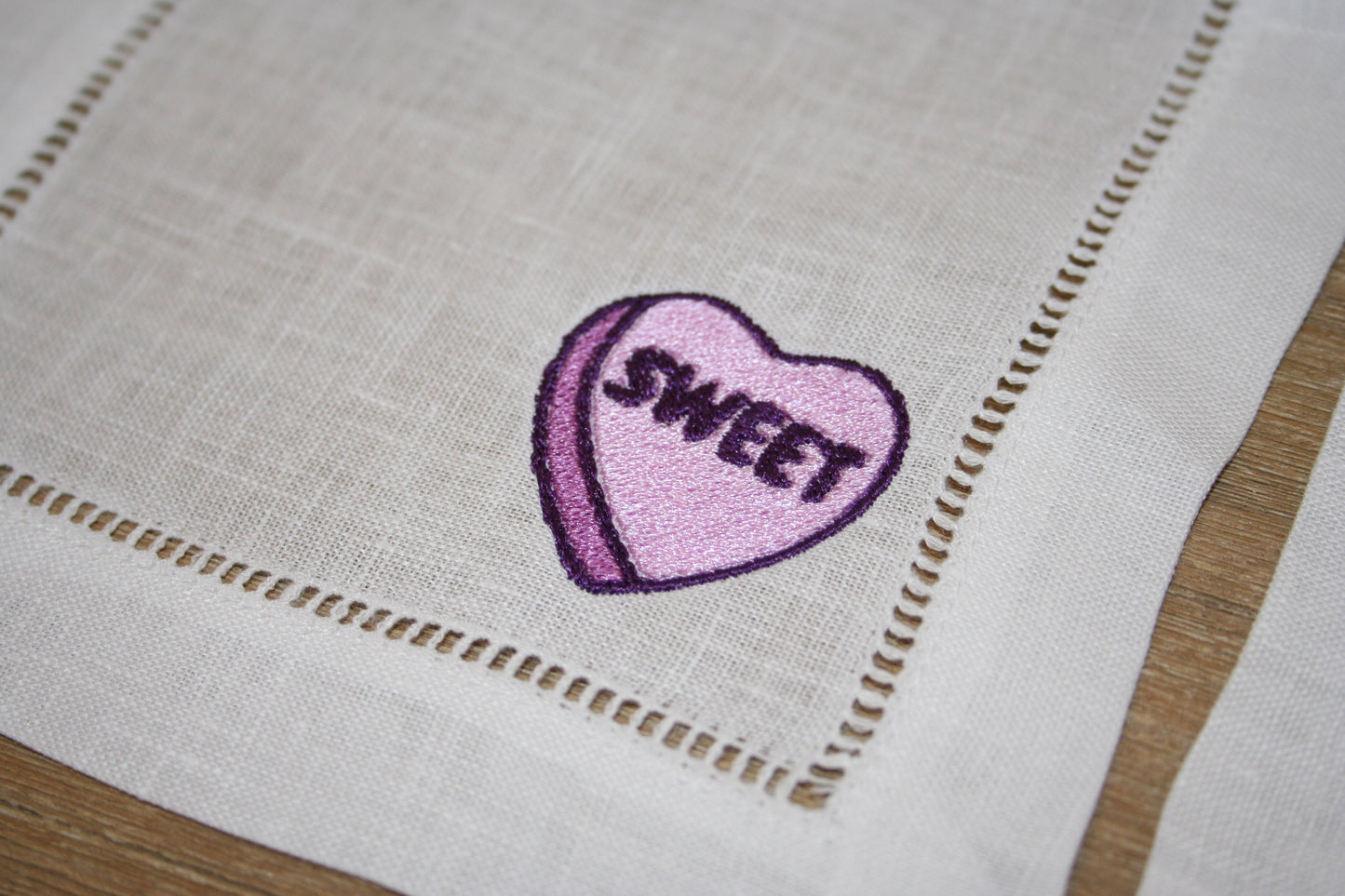 Embroidered cocktail napkins with 4 unique Valentine's Day Conversation Hearts