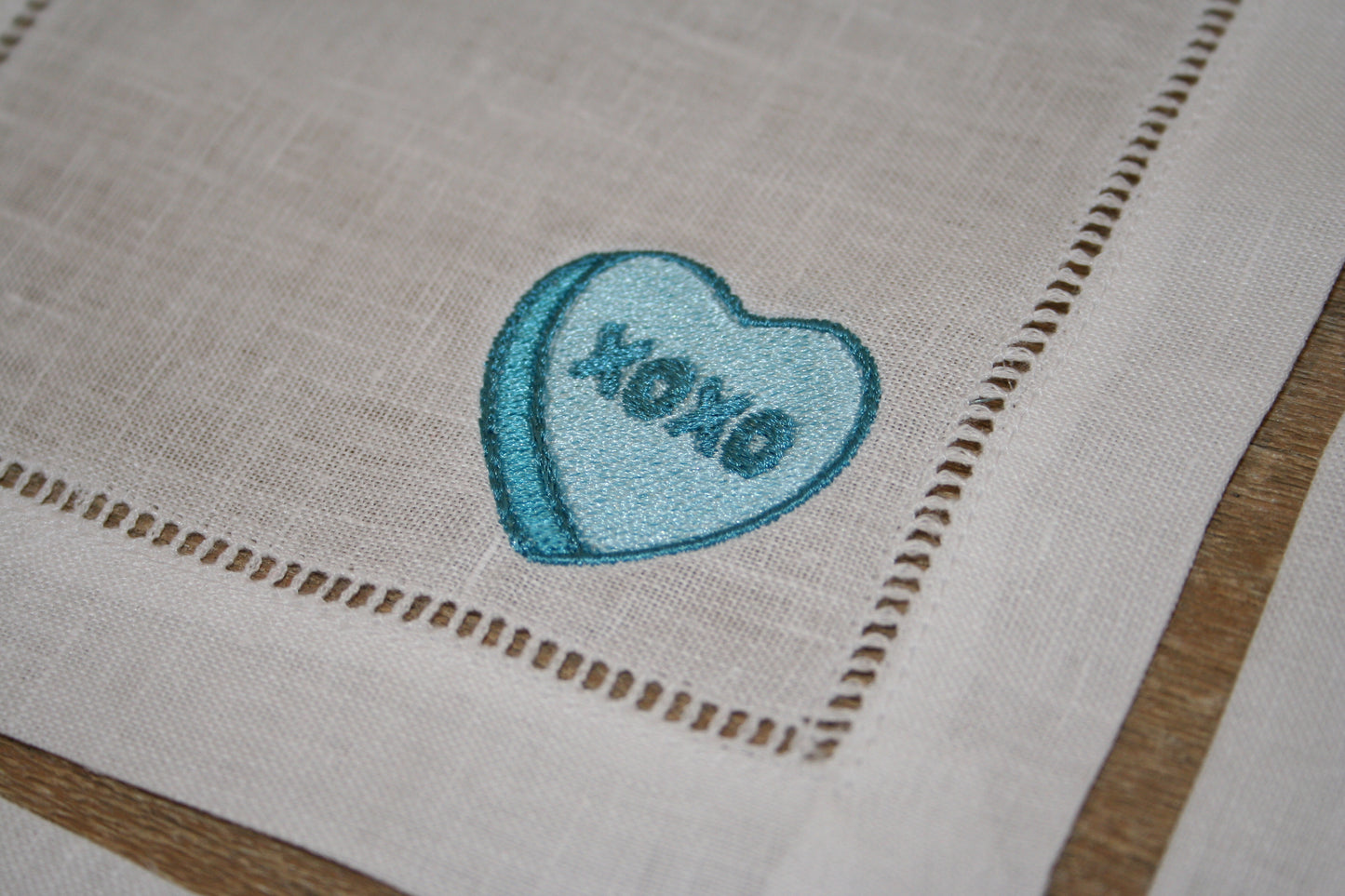 Embroidered cocktail napkins with 4 unique Valentine's Day Conversation Hearts